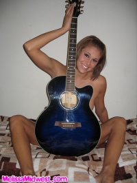 Melissa Midwest with a rock guitar #00
