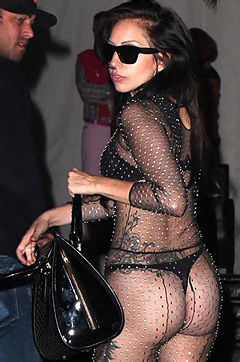 Brunette babe Lady Gaga is posing in fishnet stockings for the paparazzis.