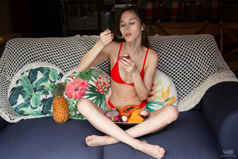 naked young lady playing and eating ripe 01